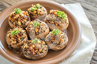 Mushrooms' caps stuffed with cheese, onion and butter Stock Photo