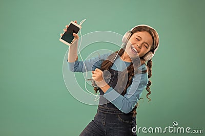 Music application. Best music apps for free. Enjoy perfect sound. Girl child listen music modern headphones and Stock Photo