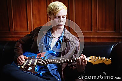 Music, artist and young man with guitar for artistic, creative and musical career with talent. Guitarist, musician and Stock Photo