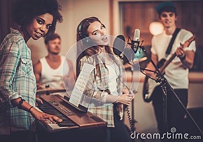 Music band performing in a studio Stock Photo