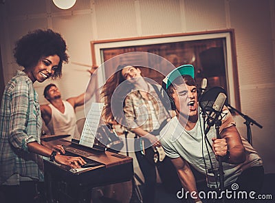 Music band performing in a studio Stock Photo