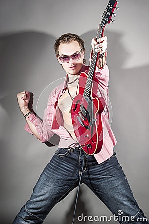 Music Concept: Portrait of Expressive Caucasian Male Guitarist P Stock Photo