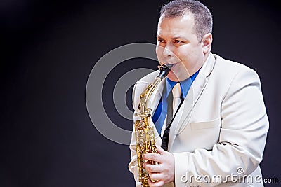 Music Concepts. Expressive Mature Caucasian Male Saxophone Player Stock Photo