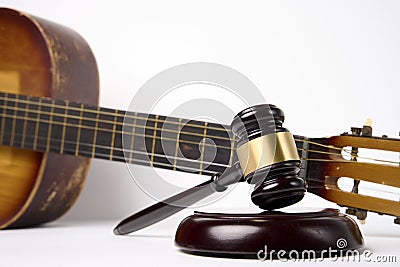 Music copyright law concept. Guitar and judge gavel Stock Photo