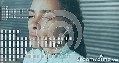 Music equalizer against close up of african american woman wearing earphones Stock Photo