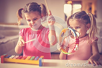 Music is good for all . Little girls at music class. Stock Photo