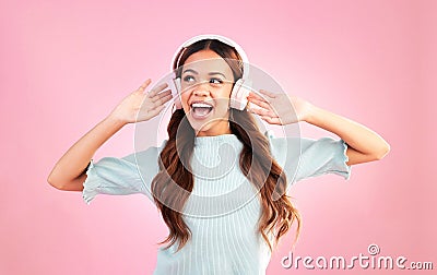 Music headphones, singing and woman dancing in studio isolated on a pink background. Singer, radio dance and happy mixed Stock Photo