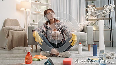 Music joy relaxed adult woman home cleaning Stock Photo