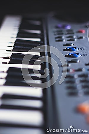 Music magician Playing the Electronic Keyboard in Music Recording studio close up on hands. Playing electronic Piano Stock Photo