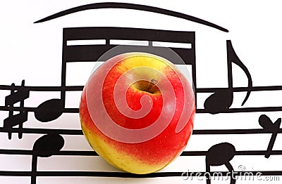 Music notation elements and apple Stock Photo