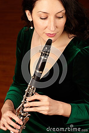 Music, performance and woman playing clarinet, orchestra musician, creative talent and classical show. Art, focus and Stock Photo