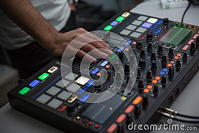 music, technology, people and equipment concept - man using mixing console Stock Photo