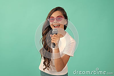 Music is what I am. Happy child sing song. Karaoke and live music. Girl singer hold microphone Stock Photo