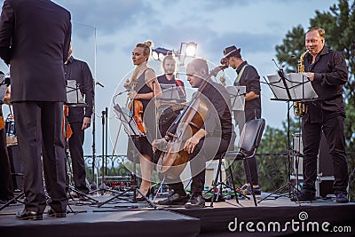 Musical ensemble having concert rehearsal on the street Stock Photo