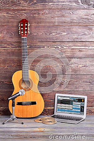 Musical equipment on wooden background. Stock Photo
