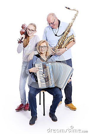 Musical family with saxophone, violin and accordion in studio Stock Photo