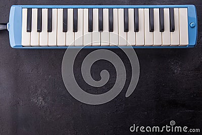 Musical instrument background with flute on black wooden, copy space. Stock Photo