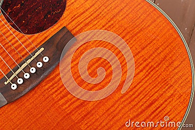 Musical instrument - Fragment orange acoustic guitar Stock Photo