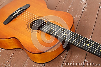 Musical instrument - Fragment retro russian acoustic guitar wood background Stock Photo
