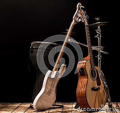 musical instruments, acoustic guitar and bass guitar and percussion instruments drums Stock Photo