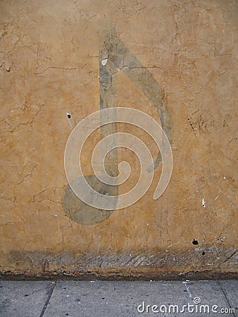 Musical note on wall Stock Photo