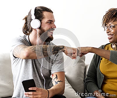 Musician couple fist bumping together Stock Photo