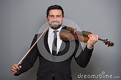 Musician man playing the violin. Musical instrument on performer Stock Photo