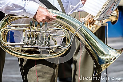 Musician of military brass band holding tuba in his hand Stock Photo