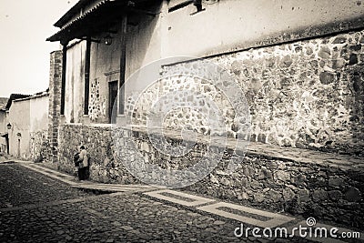 Musician playing alone in cobbled streets Editorial Stock Photo