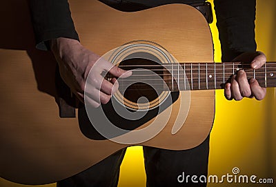 musician plays acoustic guitar Stock Photo