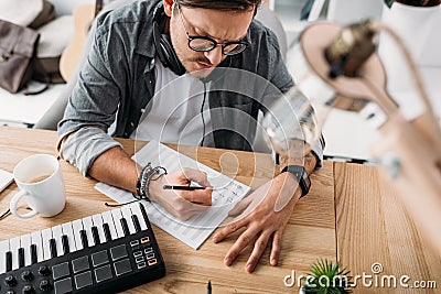 Musician writing notes Stock Photo