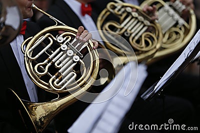 Musicians play the horn wind instrument Stock Photo