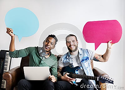 Musicians in a songwriting process holding speech bubbles collaboration and music concept Stock Photo