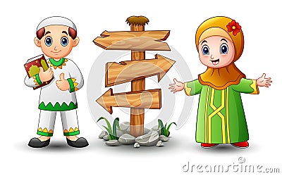 Muslim boy cartoon holding quran with girl and blank wood arrow sign Vector Illustration