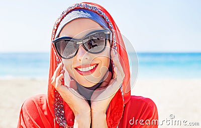 Muslim caucasian (russian) woman wearing red dress Stock Photo