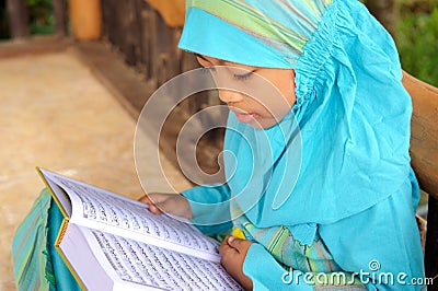 Muslim Child Reading Koran, Indonesia Stock Photo