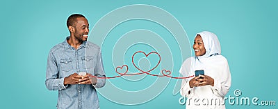 Muslim Dating App. Happy Black Man And Woman In Hijab Holding Smartphones Stock Photo