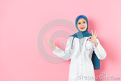 Muslim doctor carrying mobile digital tablet Stock Photo