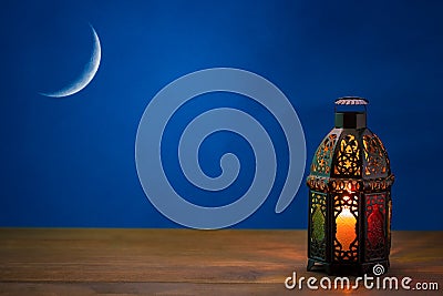 The Muslim feast of the holy month of Ramadan Kareem. Beautiful background with a shining lantern Fanus Stock Photo