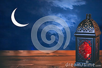 The Muslim feast of the holy month of Ramadan Kareem. Beautiful background with a shining lantern Fanus Stock Photo