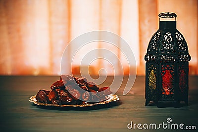 The Muslim feast of the holy month of Ramadan Kareem. Beautiful background with a shining lantern Fanus. Stock Photo