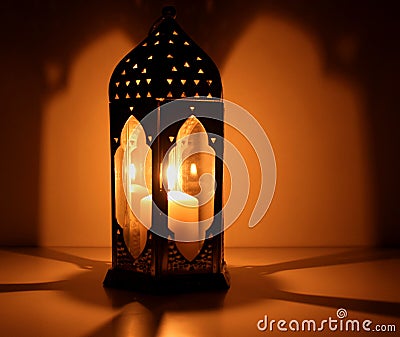 The Muslim feast of the holy month of Ramadan Kareem. Beautiful background with a shining lantern . Free space for your Stock Photo