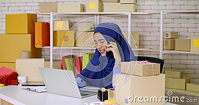 Muslim female merchandiser talking with buyer at the office Stock Photo
