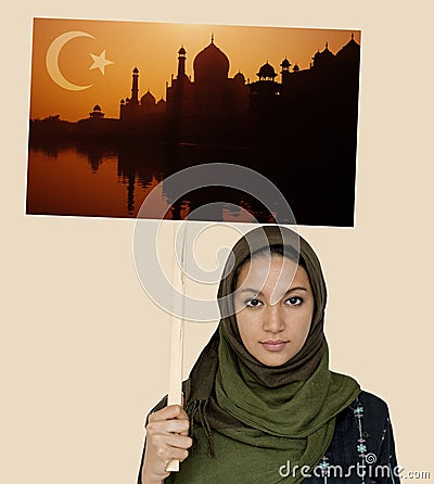 Muslim girl holding a sign Stock Photo