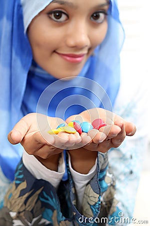 Muslim girls with chocolate Stock Photo