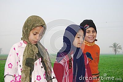 Muslim Girls playing at a farm in Egypt Editorial Stock Photo