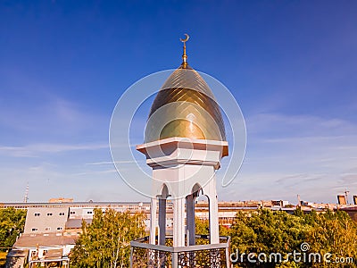 A Muslim golden dome with a crescent moon on the mosque. Minaret against the sky. Arab day. Islamic symbols of religion. Faith in Editorial Stock Photo