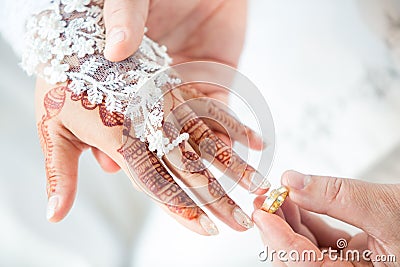 Muslim groom wears the ring bride Stock Photo