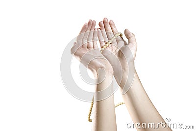 Muslim hands praying with prayer beads Stock Photo