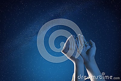 Muslim hands praying with prayer beads at outdoor Stock Photo